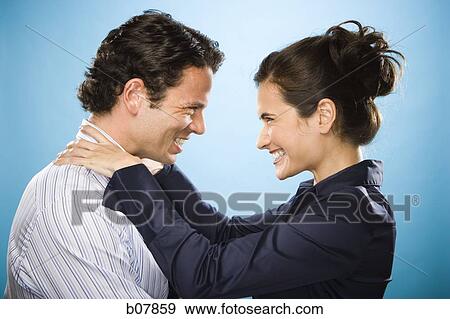 Male and female couple looking at each other View Large Photo Image Stock Photo - Male and female couple looking at each other. Fotosearch