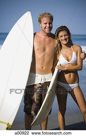 Male and female surfers View Large Photo Image Stock Image - Male and female surfers. Fotosearch
