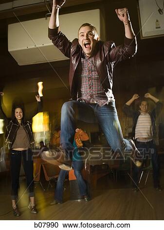 Male bowler celebrating a strike View Large Photo Image Stock Image - Male bowler celebrating a strike. Fotosearch