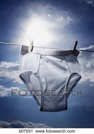 Male briefs hanging on a clothesline View Large Photo Image Stock Image - Male briefs hanging on a clothesline. Fotosearch