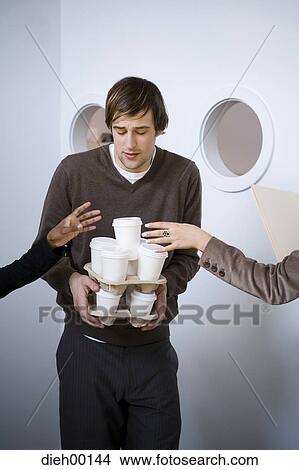 Male office worker fetching coffee View Large Photo Image Picture - Male office worker fetching coffee. Fotosearch