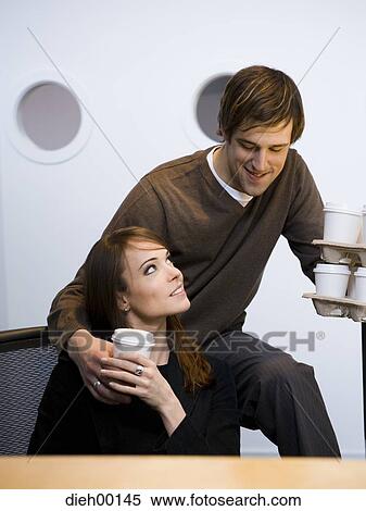 Male office worker fetching coffee View Large Photo Image Stock Photography - Male office worker fetching coffee. Fotosearch