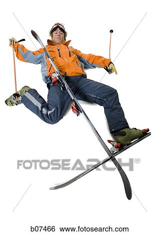 Stock Photograph - Male skier in orange ski jacket crashed. Fotosearch
