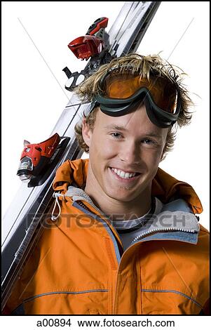 Male skier in orange ski jacket View Large Photo Image Picture - Male skier in orange ski jacket. Fotosearch