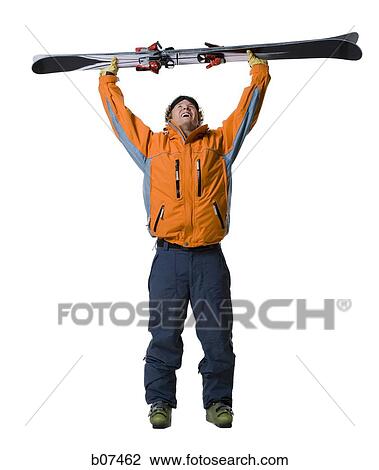 Male skier in orange ski jacket View Large Photo Image Stock Image - Male skier in orange ski jacket. Fotosearch