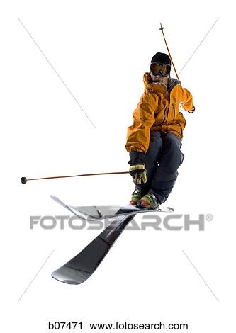 Stock Image - Male skier in orange ski jacket. Fotosearch
