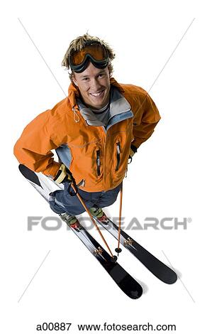 Male skier in orange ski jacket View Large Photo Image Stock Photo - Male skier in orange ski jacket. Fotosearch