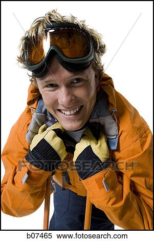 Male skier in orange ski jacket View Large Photo Image Stock Photography - Male skier in orange ski jacket. Fotosearch