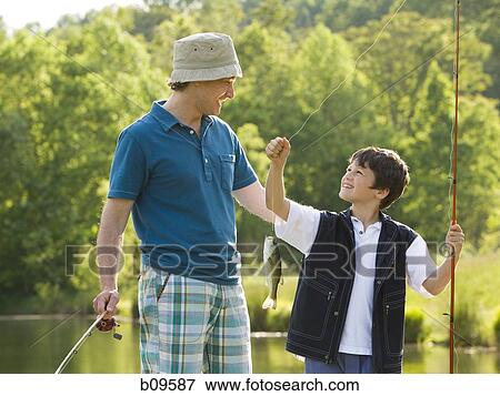man and his son fishing View Large Photo Image Stock Photo - man and his son fishing. Fotosearch