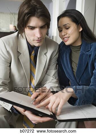 Man and woman in hotel lobby View Large Photo Image Stock Image - Man and woman in hotel lobby. Fotosearch