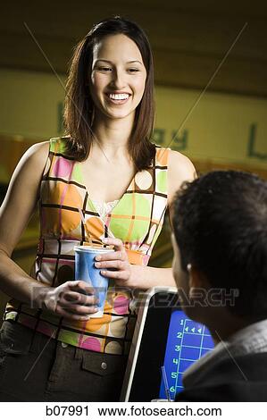 Man and woman talking at bowling alley View Large Photo Image Stock Image - Man and woman talking at bowling alley. Fotosearch