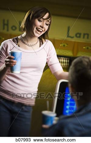 Man and woman talking at bowling alley View Large Photo Image Stock Image - Man and woman talking at bowling alley. Fotosearch