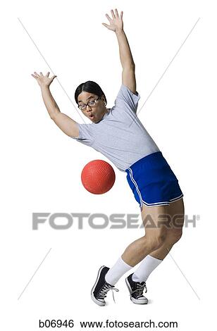 Man avoiding ball View Large Photo Image Stock Photograph - Man avoiding ball. Fotosearch
