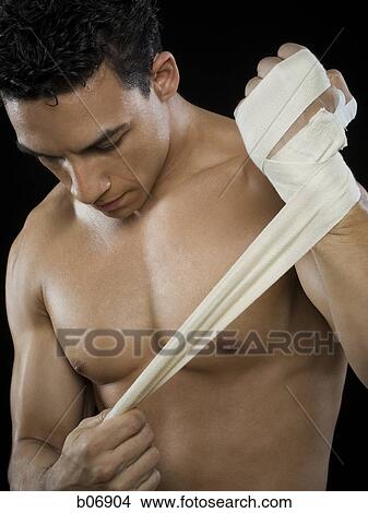 Man bandaging hand View Large Photo Image Picture - Man bandaging hand. Fotosearch