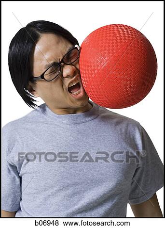 Man being hit in face with ball View Large Photo Image Stock Photo - Man being hit in face with ball. Fotosearch