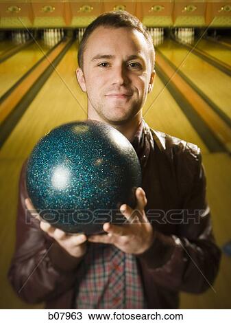 Man bowling in alley View Large Photo Image Stock Image - Man bowling in alley. Fotosearch