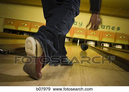 Man bowling in alley View Large Photo Image Stock Photo - Man bowling in alley. Fotosearch