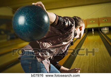 Man bowling in alley View Large Photo Image Stock Photograph - Man bowling in alley. Fotosearch