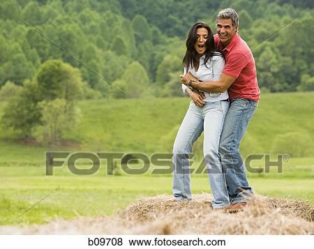 man embracing a woman from behind View Large Photo Image Stock Photo - man embracing a woman from behind. Fotosearch