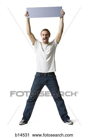 Man holding blank sign View Large Photo Image Stock Image - Man holding blank sign. Fotosearch