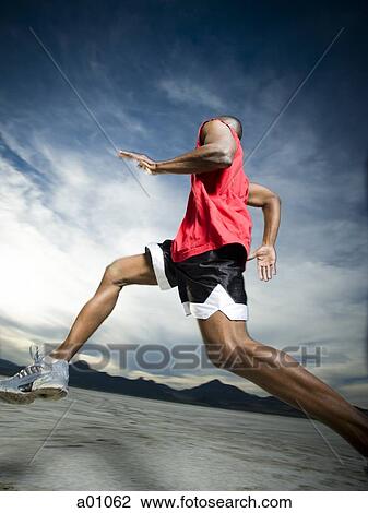 Man Jogging on the Salt Flats View Large Photo Image Stock Image - Man Jogging on the Salt Flats. Fotosearch
