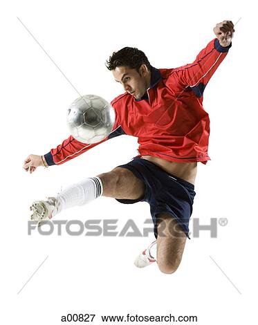 Stock Photo - Man jumping for soccer ball. Fotosearch