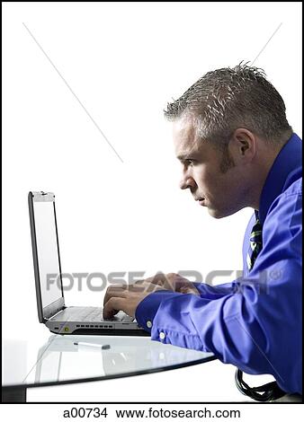 Man on a laptop View Large Photo Image Picture - Man on a laptop. Fotosearch