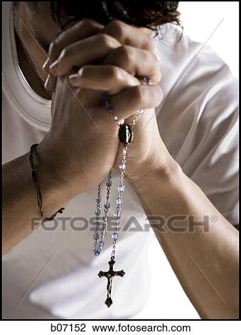 Stock Image - Man praying. Fotosearch