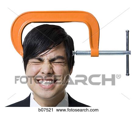 Man with C-Clamp on head View Large Photo Image Stock Image - Man with C-Clamp on head. Fotosearch