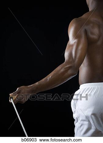 Man with skipping rope View Large Photo Image Stock Image - Man with skipping rope. Fotosearch