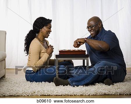 Mature couple playing a board game View Large Photo Image Stock Image - Mature couple playing a board game. Fotosearch