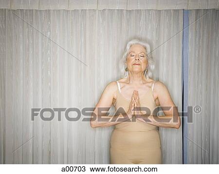 Mature woman doing yoga View Large Photo Image Stock Image - Mature woman doing yoga. Fotosearch