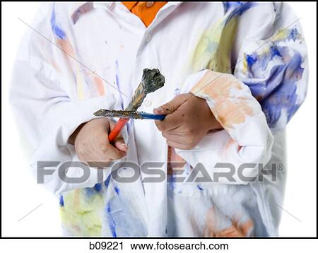 Mid section view of a boy holding a paintbrush View Large Photo Image Stock Image - Mid section view of a boy holding a paintbrush. Fotosearch