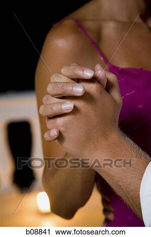 Mid section view of a man and woman dancing View Large Photo Image Stock Image - Mid section view of a man and woman dancing. Fotosearch
