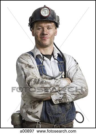 Stock Photo - Mine worker with flashlight helmet. Fotosearch