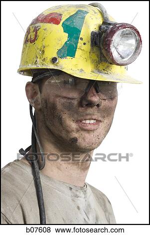 Stock Photo - Miner with flashlight helmet. Fotosearch