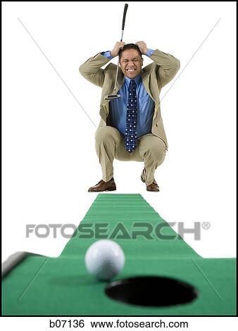 Stock Photograph - Minigolfer with ball and hole. Fotosearch