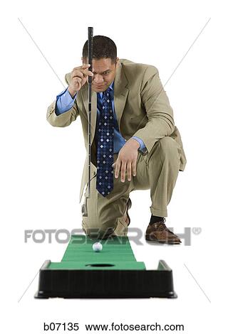 Stock Photography - Minigolfer with ball and hole. Fotosearch