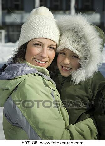 Mother and child in winter coats View Large Photo Image Stock Photo - Mother and child in winter coats. Fotosearch