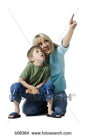 Mother and her son looking up View Large Photo Image Picture - Mother and her son looking up. Fotosearch
