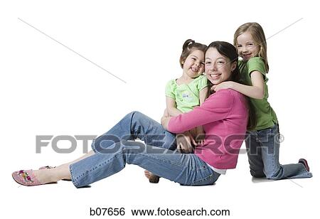 Mother posing with young daughters View Large Photo Image Stock Photograph - Mother posing with young daughters. Fotosearch