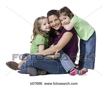 Mother posing with young daughters View Large Photo Image Stock Photograph - Mother posing with young daughters. Fotosearch