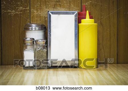 Napkins and restaurant condiments View Large Photo Image Stock Image - Napkins and restaurant condiments. Fotosearch