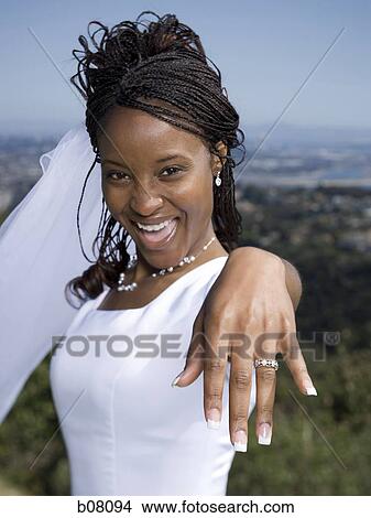 New bride showing off wedding ring View Large Photo Image Picture - New bride showing off wedding ring. Fotosearch