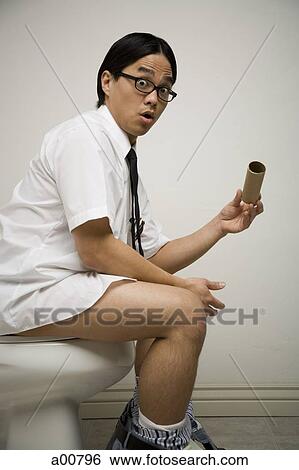 Office worker on toilet noticing end of roll View Large Photo Image Stock Photograph - Office worker on toilet noticing end of roll. Fotosearch