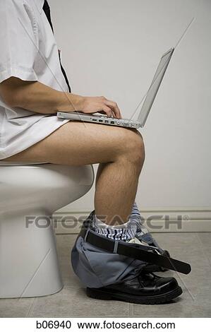 Office worker on toilet using laptop View Large Photo Image Stock Image - Office worker on toilet using laptop. Fotosearch