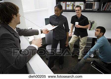 Office workers talking View Large Photo Image Stock Photography - Office workers talking. Fotosearch