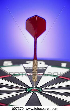 One dart resting in bulls eye View Large Photo Image Stock Image - One dart resting in bulls eye. Fotosearch