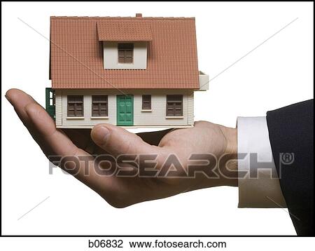 One hand holding model of house View Large Photo Image Stock Image - One hand holding model of house. Fotosearch