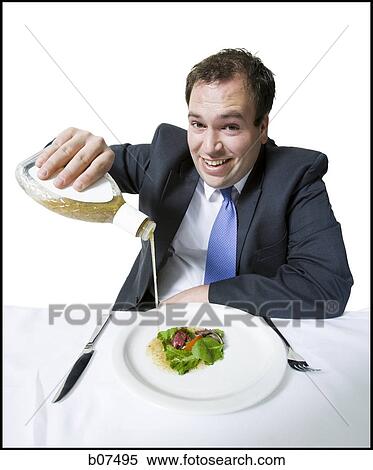 Overweight businessman eating a small salad View Large Photo Image Stock Photography - Overweight businessman eating a small salad. Fotosearch
